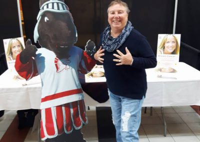 Lorna Larsen with the SAIT Trojans' mascot - 2017