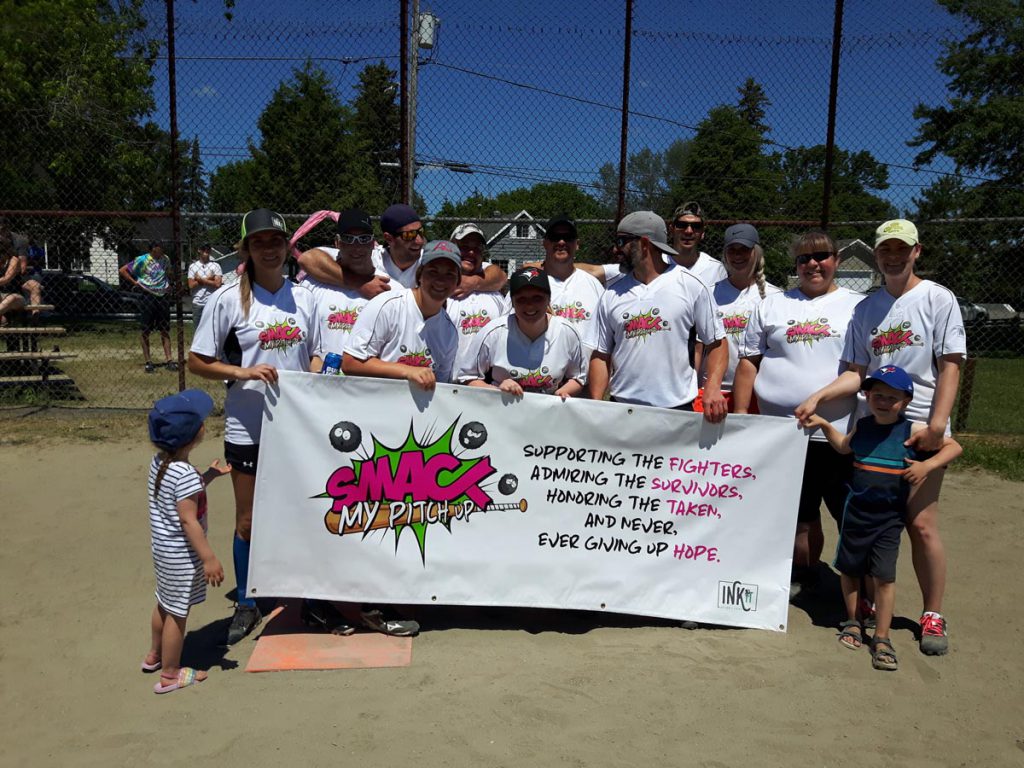 Knock Cancer Out of the Park 2019: InkIt Design and Print baseball team with their sign.