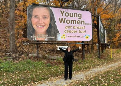 Amy standing by one of her campaign signs in Peterborough